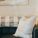 Inside picture of black couch with pillow and seascape, Carolina Counseling located in Greenville, NC