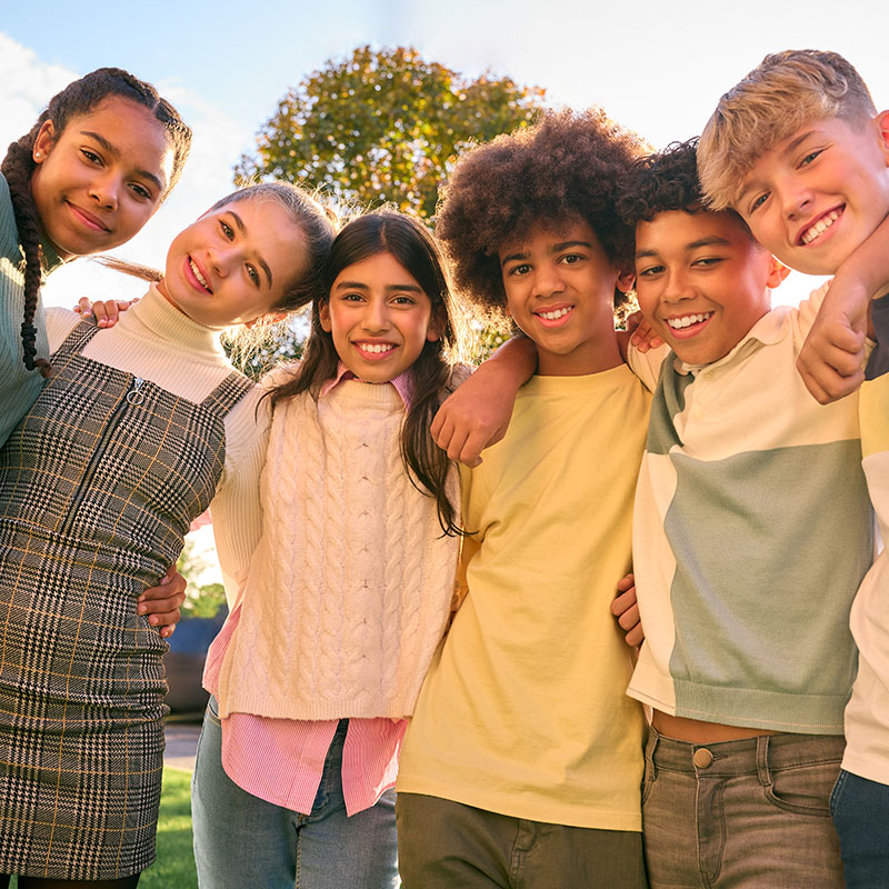 Group of kids stnainf outside - Carolina Counseling NC